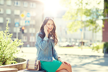 Image showing happy young woman or girl calling on smartphone