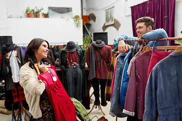 Image showing couple choosing clothes at vintage clothing store