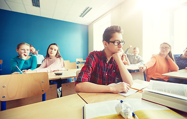 Image showing classmates laughing at student boy in school