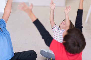 Image showing young boys having fun on the floor