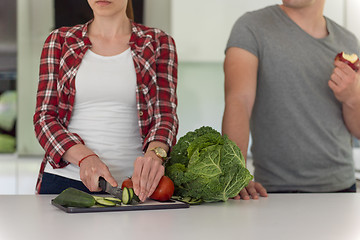 Image showing Young handsome couple in the kitchen