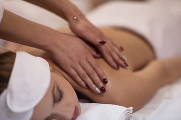 Image showing woman receiving a back massage