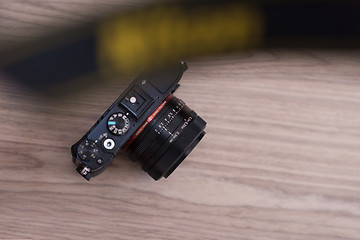 Image showing camera on a wooden table