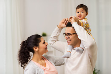 Image showing happy family and baby daughter playing at home