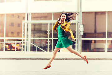 Image showing smiling young woman or girl calling on smartphone