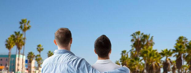 Image showing close up of gay couple hugging over los angeles