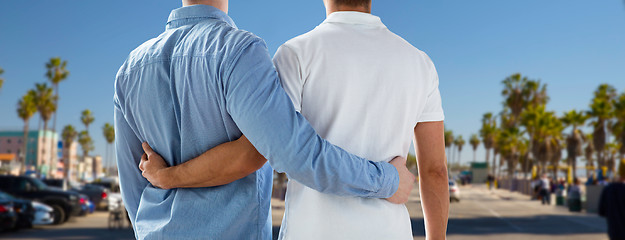 Image showing close up of gay couple hugging over los angeles