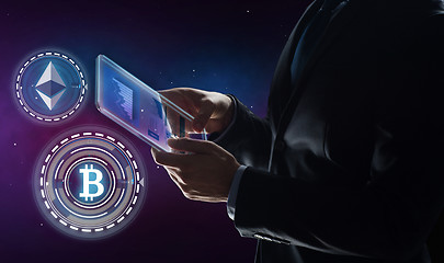 Image showing businessman with tablet pc and cryptocurrency