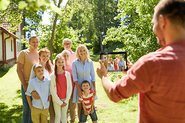 Image showing happy family photographing by tablet pc in summer