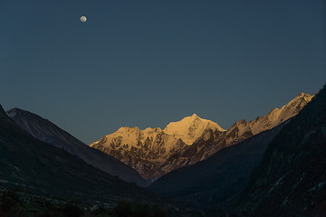 Image showing Langtang valley moonrise over mountain