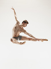 Image showing The male athletic ballet dancer performing dance isolated on white background.