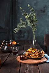 Image showing Fresh homemade french crepes made with eggs, milk and flour, filled with marmalade on a vintage plate