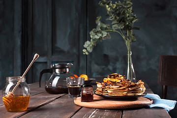 Image showing Fresh homemade french crepes made with eggs, milk and flour, filled with marmalade on a vintage plate