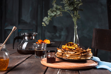 Image showing Fresh homemade french crepes made with eggs, milk and flour, filled with marmalade on a vintage plate