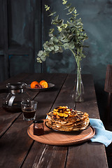 Image showing Fresh homemade french crepes made with eggs, milk and flour, filled with marmalade on a vintage plate