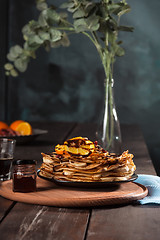 Image showing Fresh homemade french crepes made with eggs, milk and flour, filled with marmalade on a vintage plate