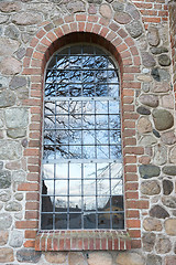 Image showing Tree reflection in a window. Uggeløse church in 2017