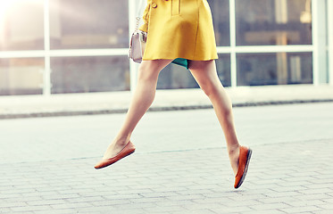 Image showing young woman or teenage girl legs on city street