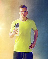 Image showing smiling man with protein shake bottle