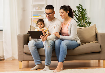 Image showing mother, father and baby with tablet pc at home
