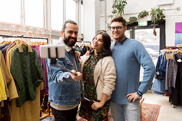 Image showing friends taking selfie at vintage clothing store