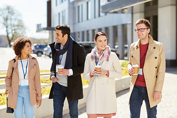 Image showing office workers with coffee on city street