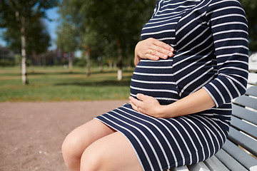 Image showing Pregnant woman in striped dress