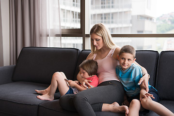Image showing young mother spending time with kids