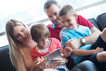 Image showing happy young couple spending time with kids