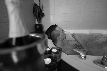 Image showing man relaxing in the jacuzzi