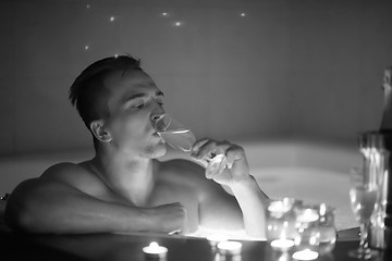 Image showing man relaxing in the jacuzzi