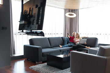 Image showing happy couple relaxes in the living room