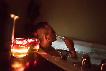 Image showing man relaxing in the jacuzzi