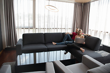 Image showing happy couple relaxes in the living room