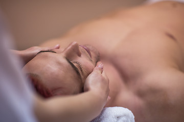 Image showing man receiving a head massage