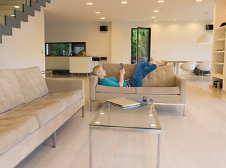 Image showing woman on sofa using tablet computer