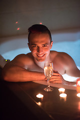 Image showing man relaxing in the jacuzzi