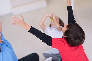 Image showing young boys having fun on the floor