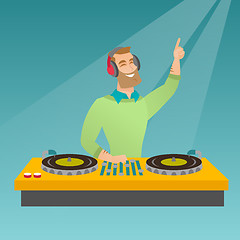 Image showing DJ mixing music on the turntables.