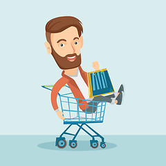 Image showing Happy man riding in shopping trolley.