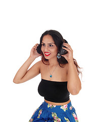 Image showing Young woman listening to music