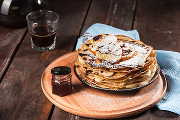 Image showing Fresh homemade french crepes made with eggs, milk and flour, filled with marmalade on a vintage plate