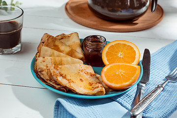 Image showing Fresh homemade french crepes made with eggs, milk and flour, filled with marmalade on a vintage plate