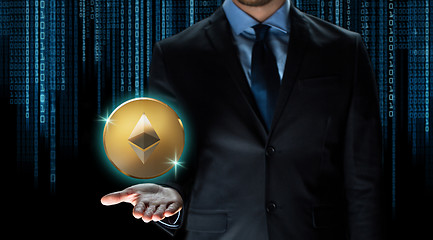 Image showing businessman with ethereum coin over binary code