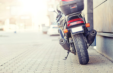 Image showing close up of motorcycle parked on city street