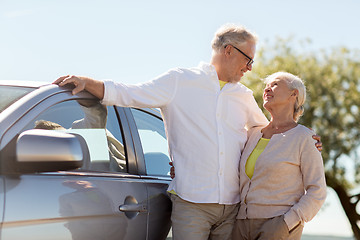 Image showing happy senior couple with car in summer