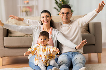 Image showing happy family with baby daughter at home