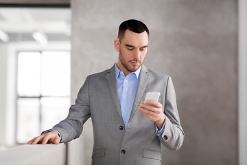 Image showing businessman with smarphone at office