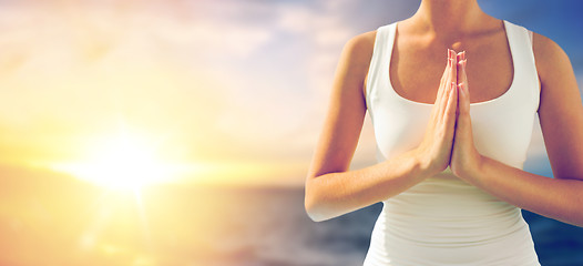 Image showing close up of woman making greeting gesture outdoors