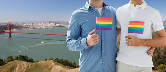 Image showing men with gay pride flags over golden gate bridge